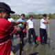 The fossil hunters: Félix Orocú (red shirt); his son, Joel Orocú (holding shovel); and students from Colegio Punta Burica and Escuela Primaria Caña Blanca.